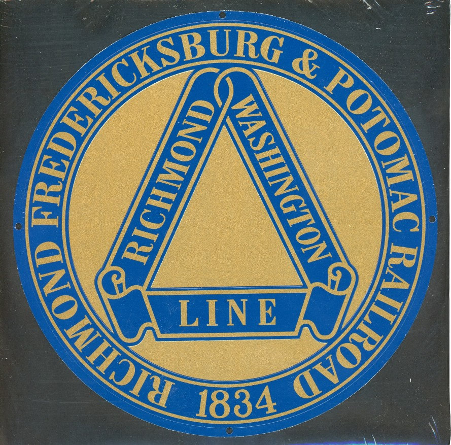 Color photo of metal plate with RF&P railroad logo from 1949. Blue and gold in color.